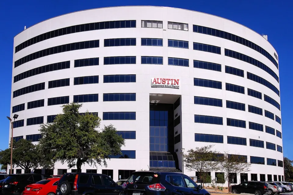 White multistory Austin Independent School District headquearters building in Austin, Texas.